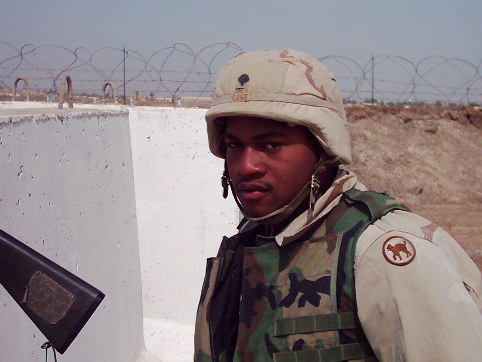 Stephen Cruz on guard at a concrete barrier, March 12, 2004.